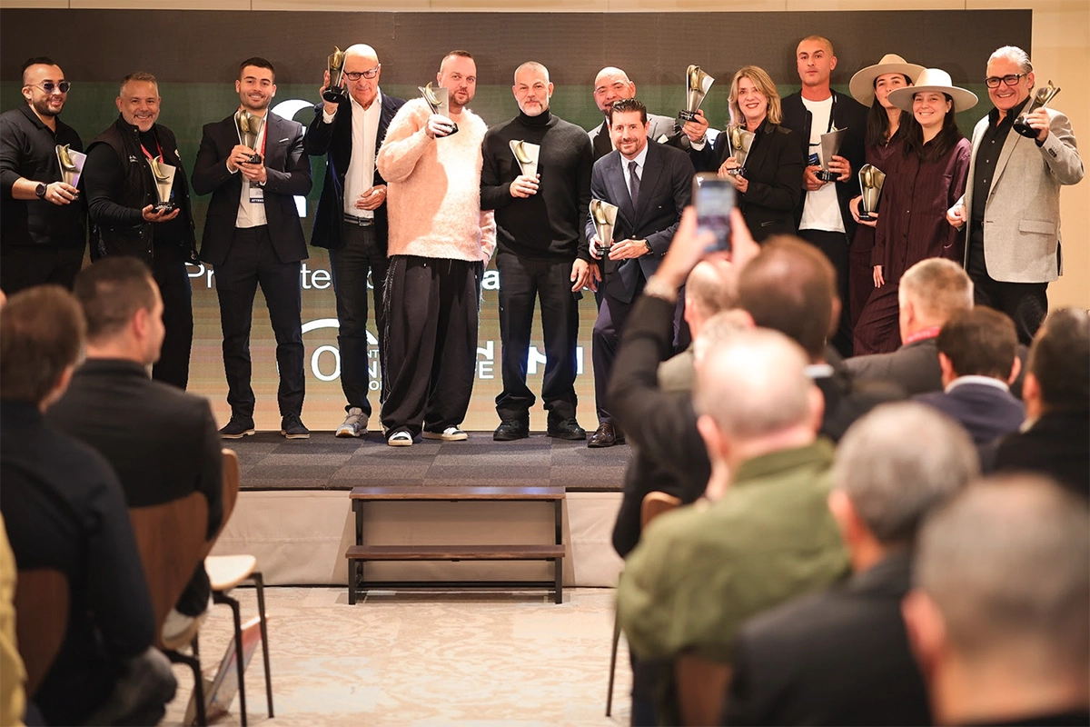 Winners of the Golden Moon Awards standing on stage with trophies during the global club ranking ceremony